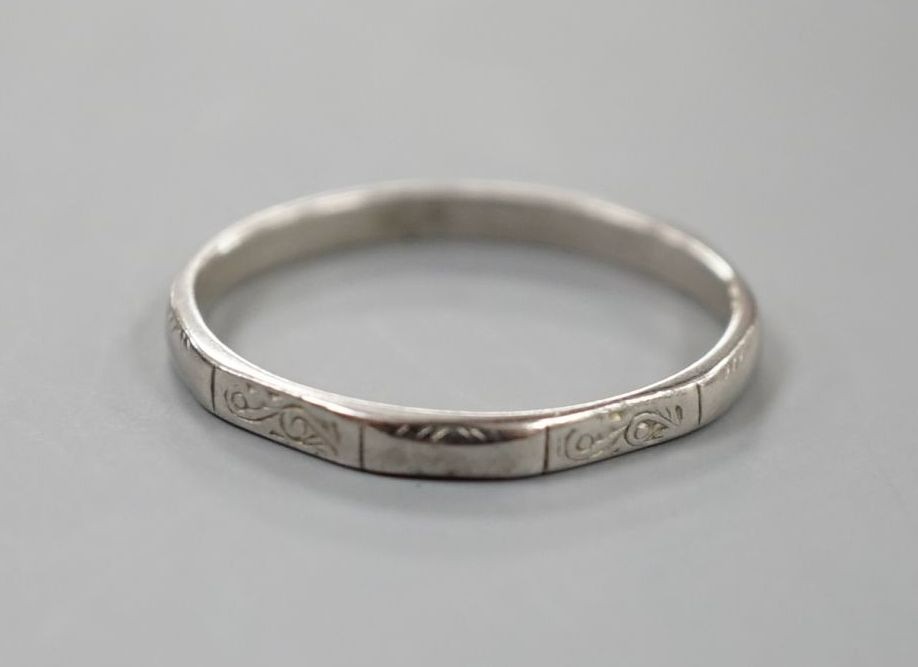 A white metal (stamped platinum) wedding band, size K